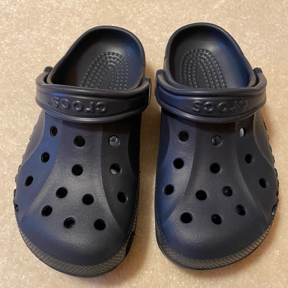 Brand New Crocs Navy Blue men 4 women’s 6